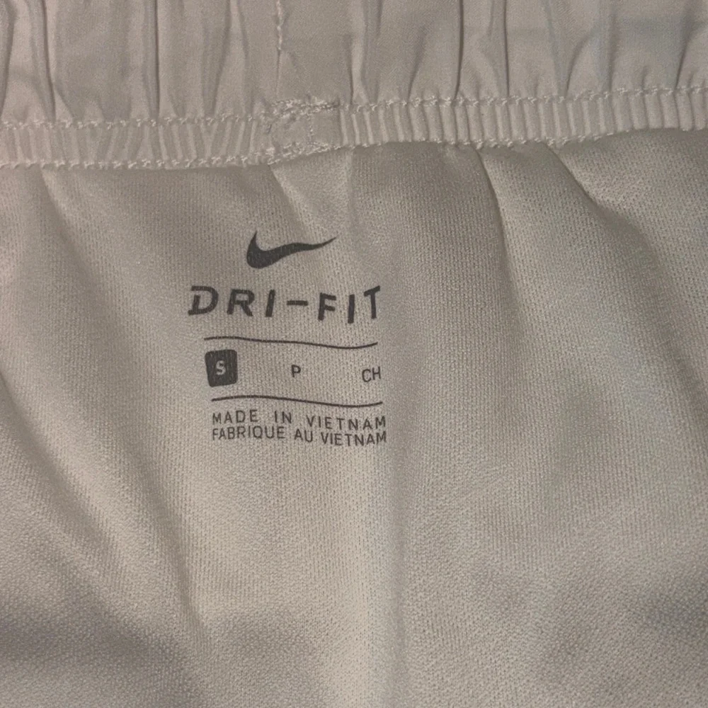 Nike Running Tempo Dri-FIT mid rise 3 inch shorts in white